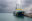 Such- und Rettungsschiff Humanity 1 in einem italienischen Hafen mit dramatischen Wolken.