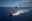 Das Schnellboot ist auf dem Weg zu einem Seenotfall, im Hintergrund befindet sich die Humanity 1.